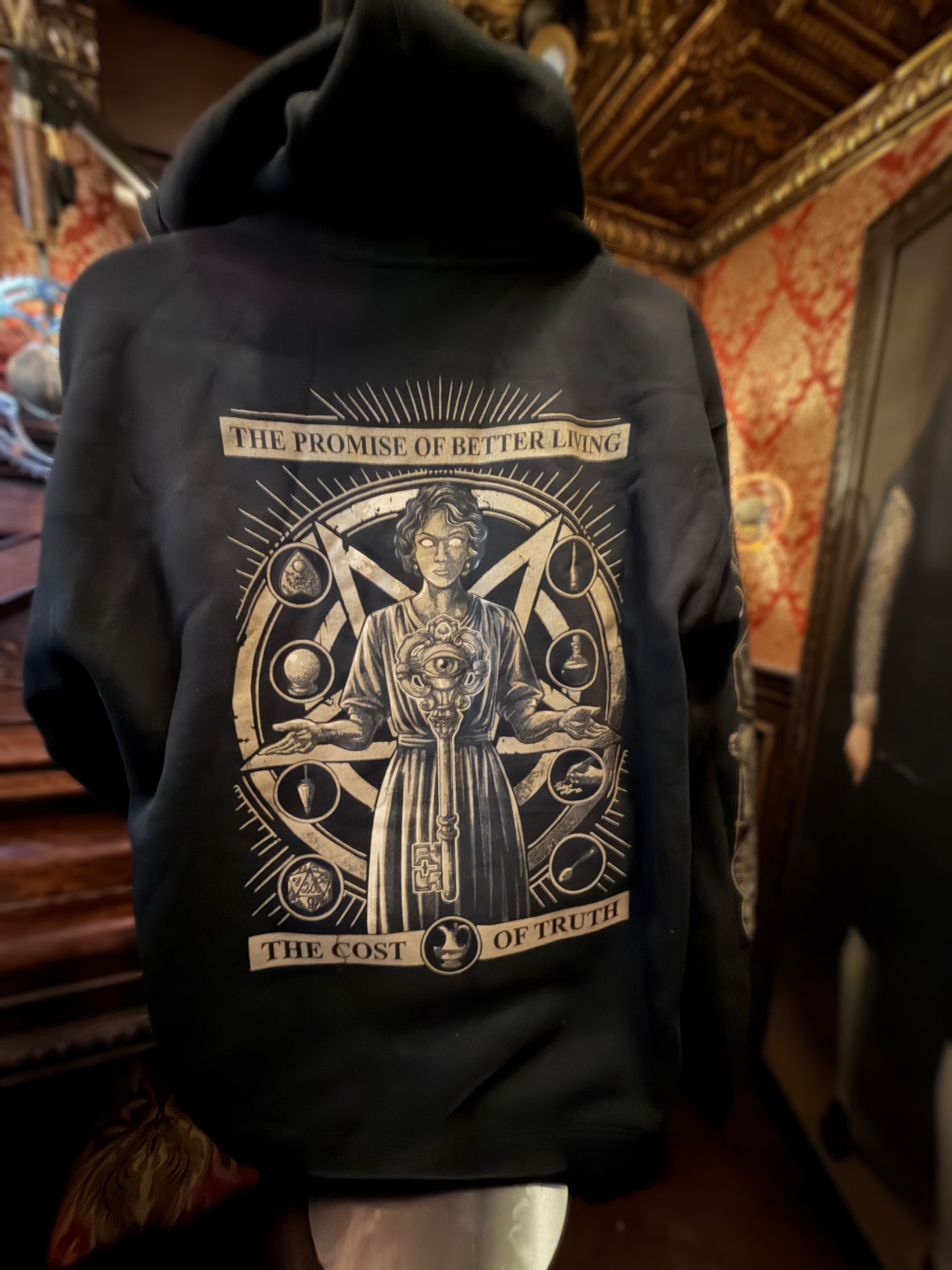 - NEW! "Cost of Truth" black hoodie -